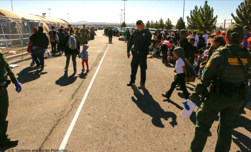 Border Patrol Officers and Migrants at U.S.-Mexico Border