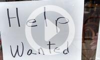 Help Wanted sign offers employment in a restaurant in Bethesda, Maryland
